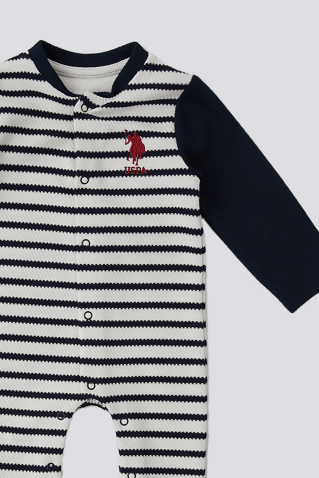 U.S. Polo Assn. Salopeta pentru bebelusi cu botosei si model in dungi